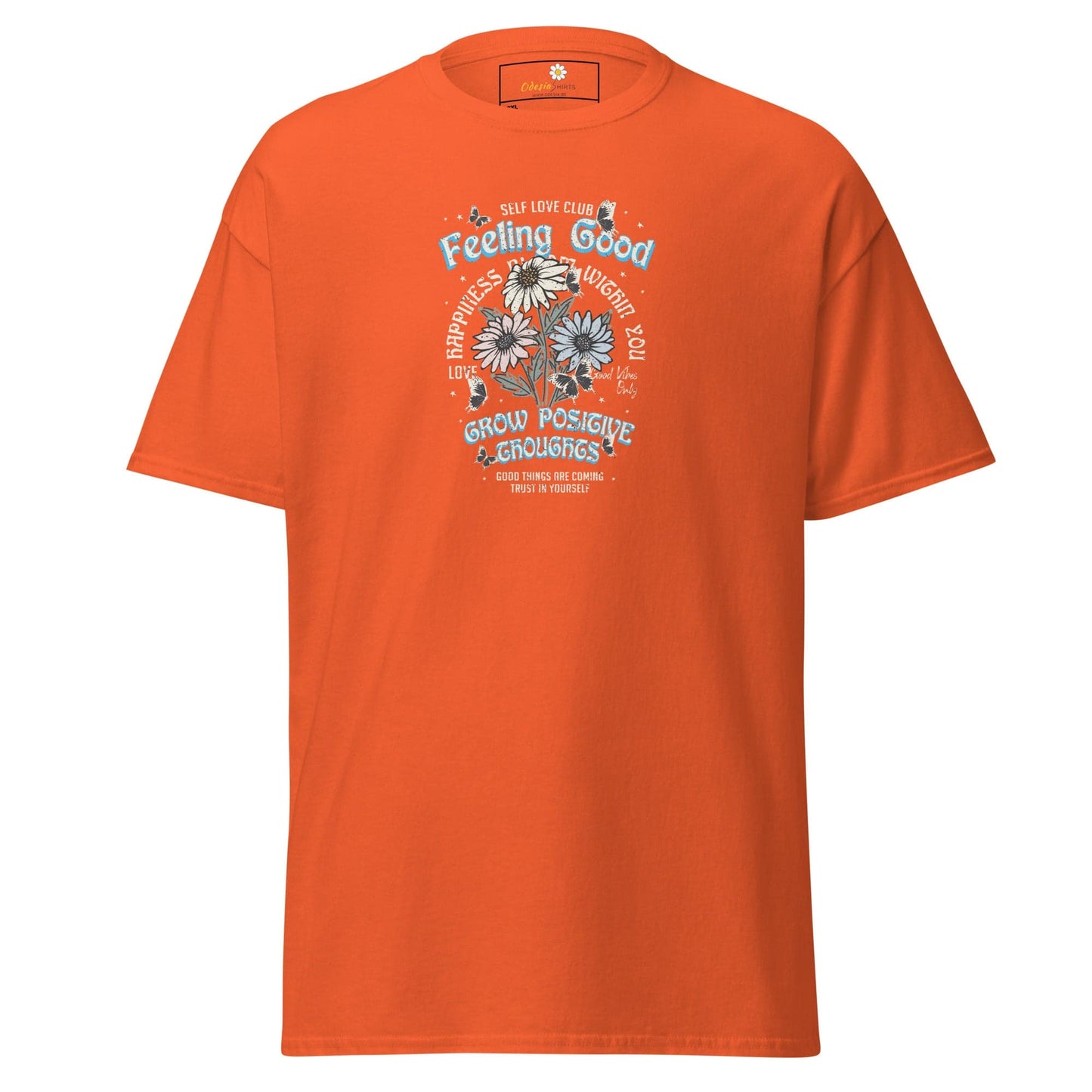 Orange t-shirt with floral graphic.